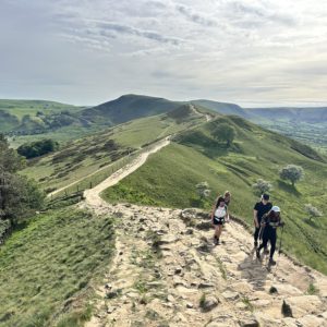 Group of women hikers walking along the Edale Skyline route in the Peak District