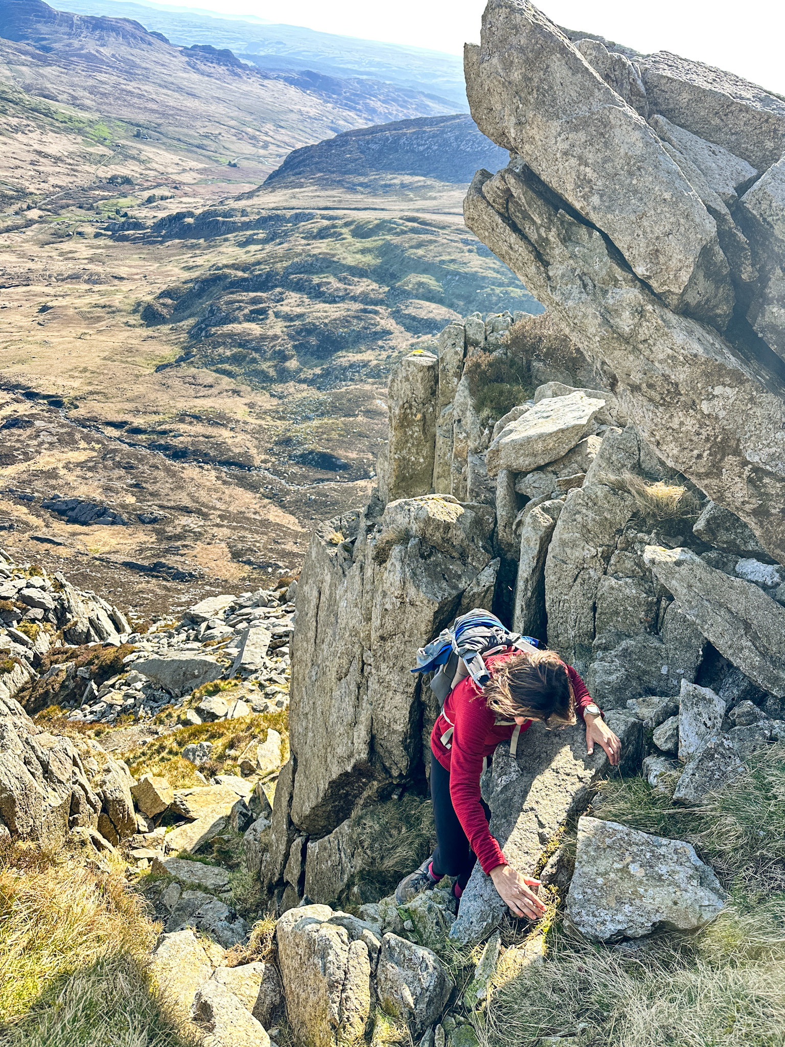 woman scrambling mountains